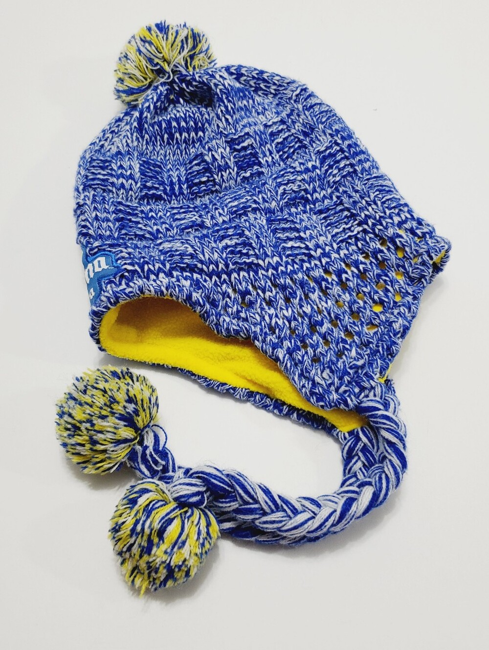 Corona Unisex Knit Winter Hat Blue & Yellow Pattern Ear Flaps Tails Pom OS